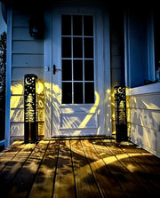 Decorative outdoor garden columns on a wooden deck with a house door in the background