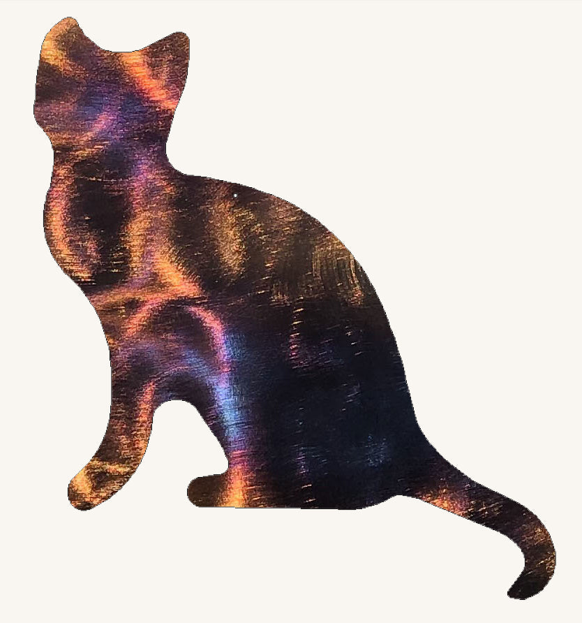 Metallic cat-shaped object on a white background