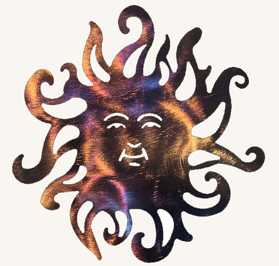 Decorative metal sun with face design on a white background