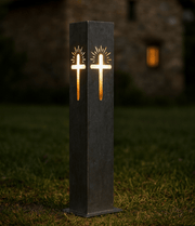 Decorative Garden Column Pillar with cross design on a grassy area at night.