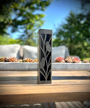 Outdoor Decorative Column with bird design on a wooden surface outdoors