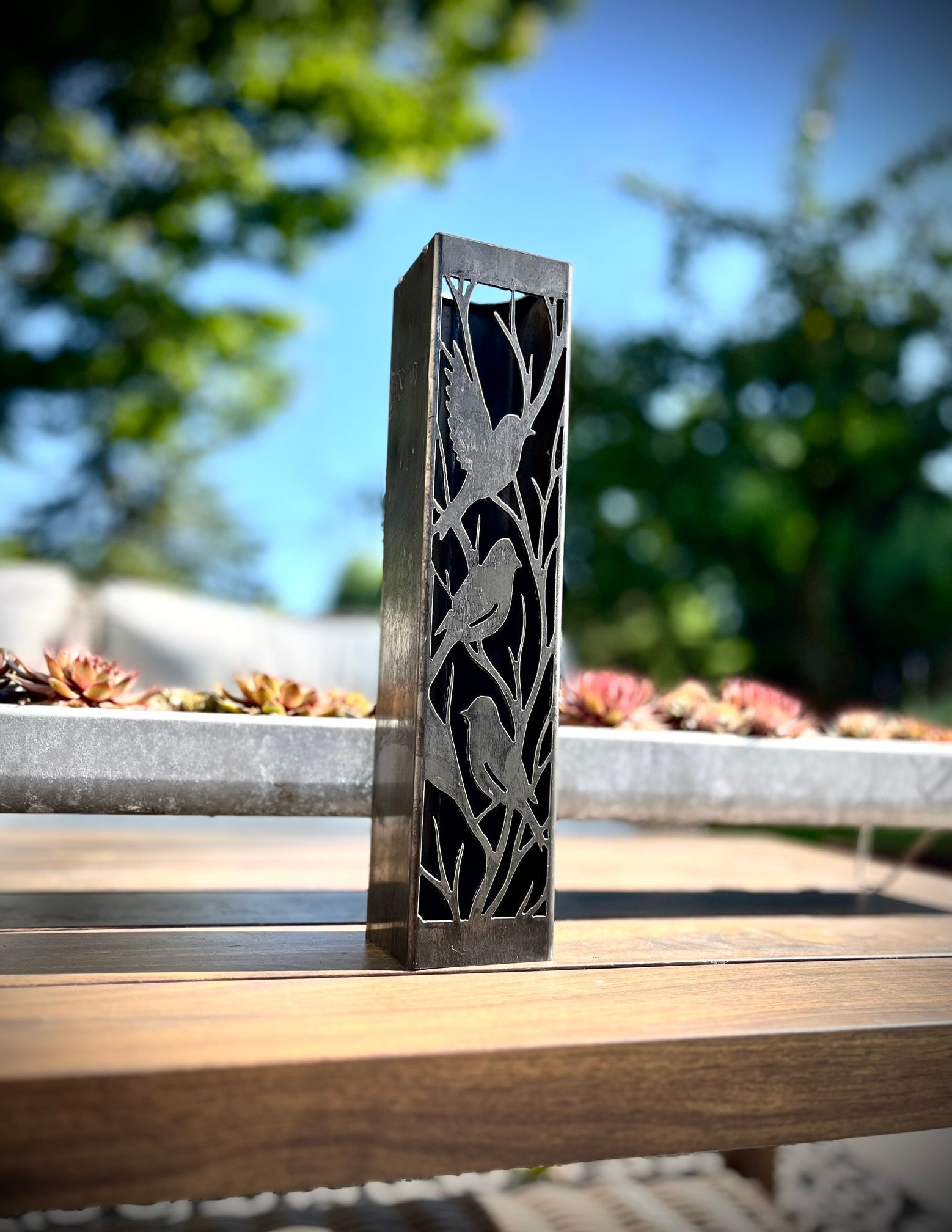 Outdoor Decorative Column with bird pattern on a wooden surface outdoors