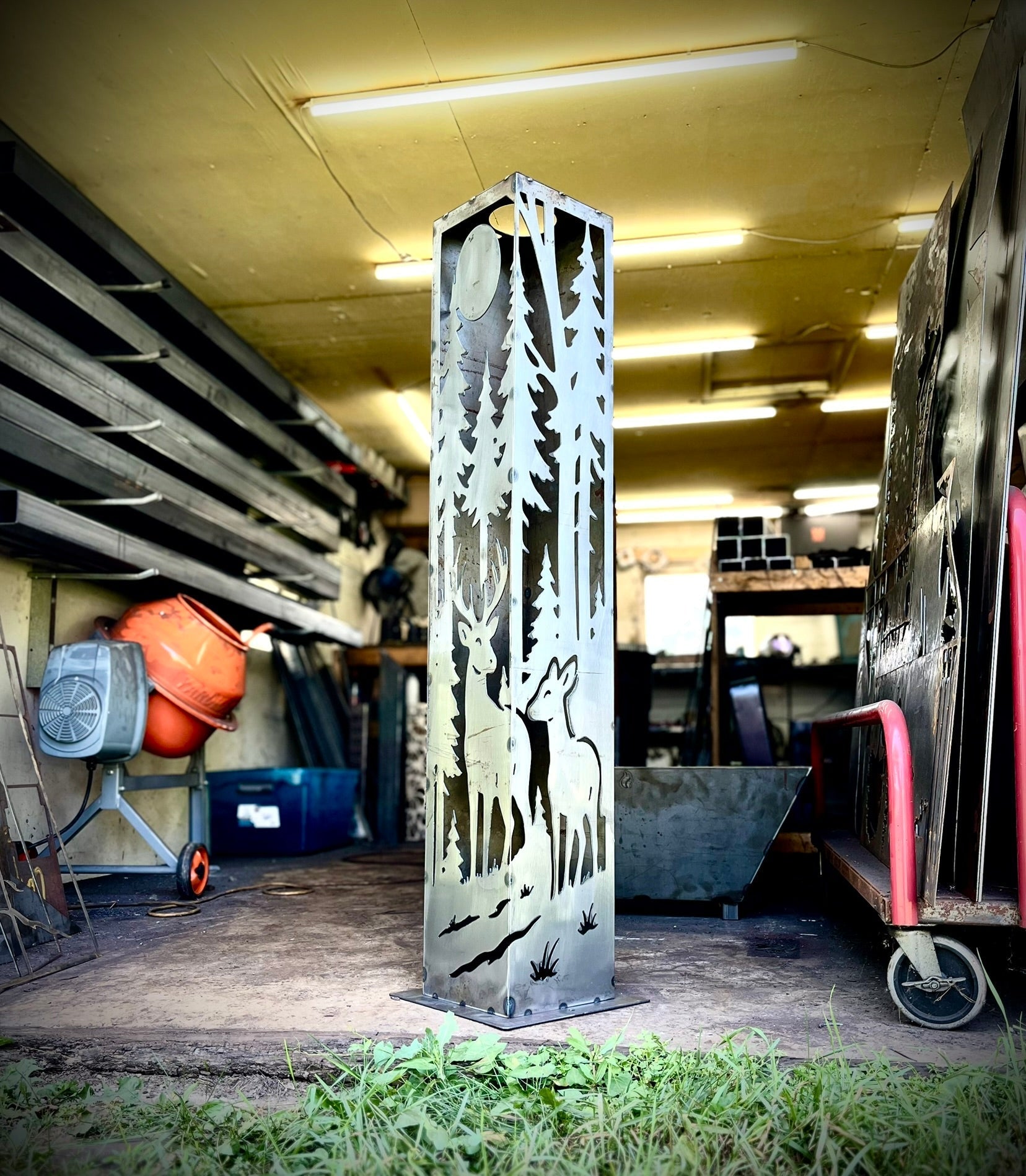 Metal decorative pillar with nature design in a workshop setting