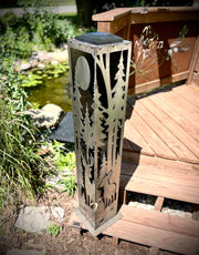 Decorative outdoor pillar with nature-themed design on a wooden deck