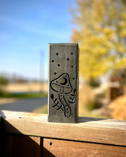 Decorative metal Garden Pillar with engraved design on a wooden surface outdoors