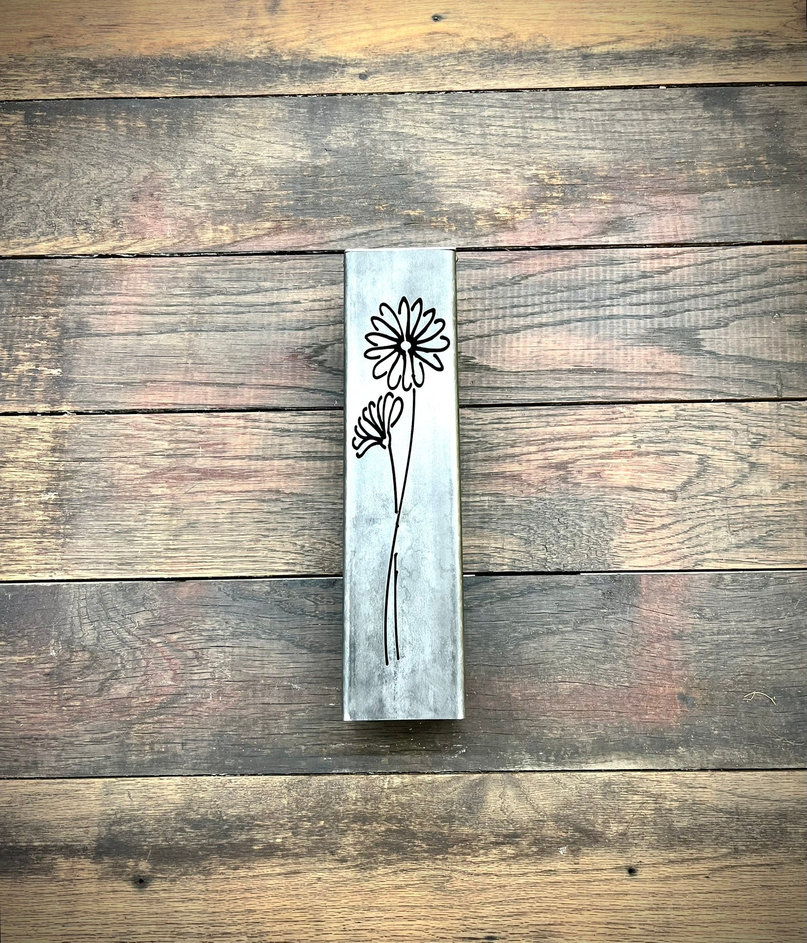 Outdoor Decorative Pillar with floral design on a wooden surface