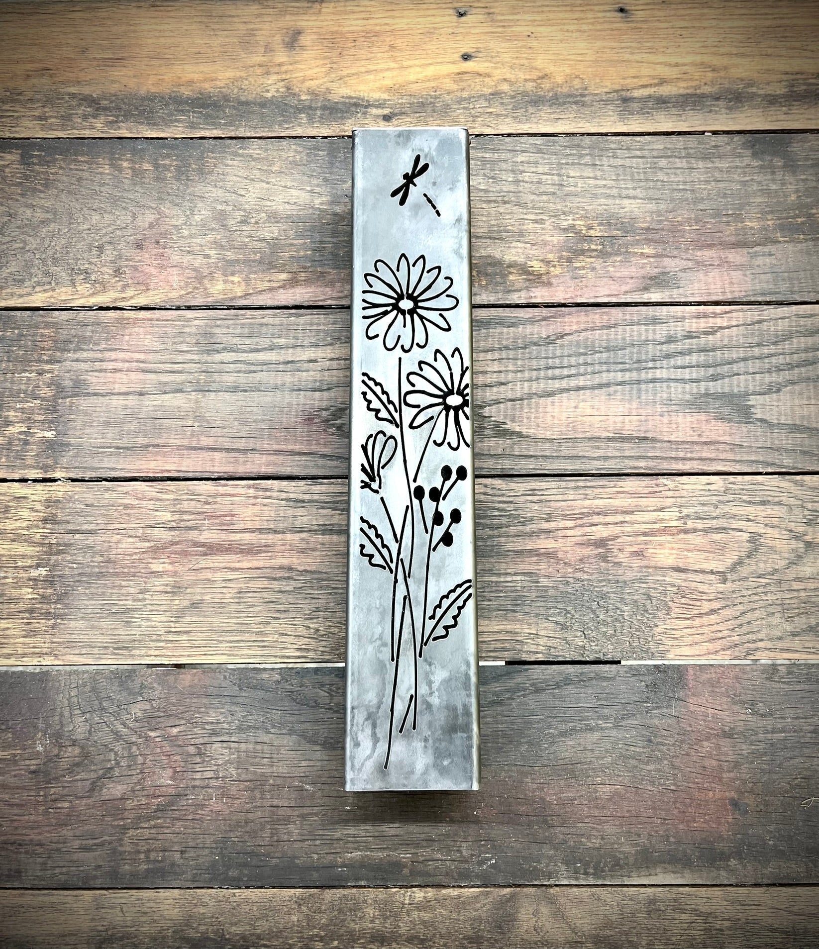 Outdoor Decorative Pillar with floral patterns on a wooden background