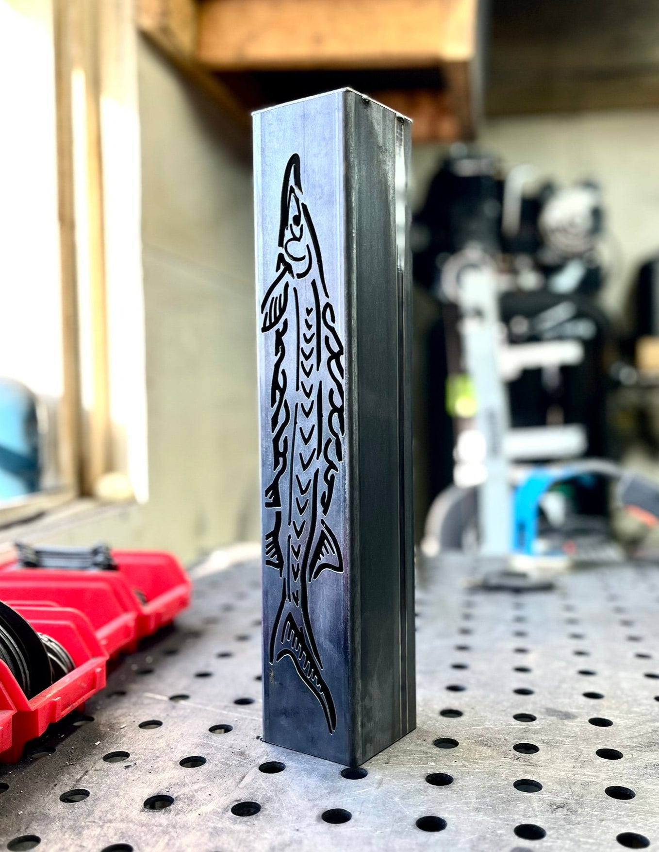 Garden column pillar with shark design on a workbench