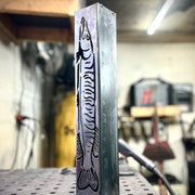 Garden column pillar with fish design in a workshop setting