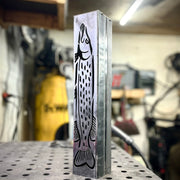 Garden column pillar with fish design on a workshop table