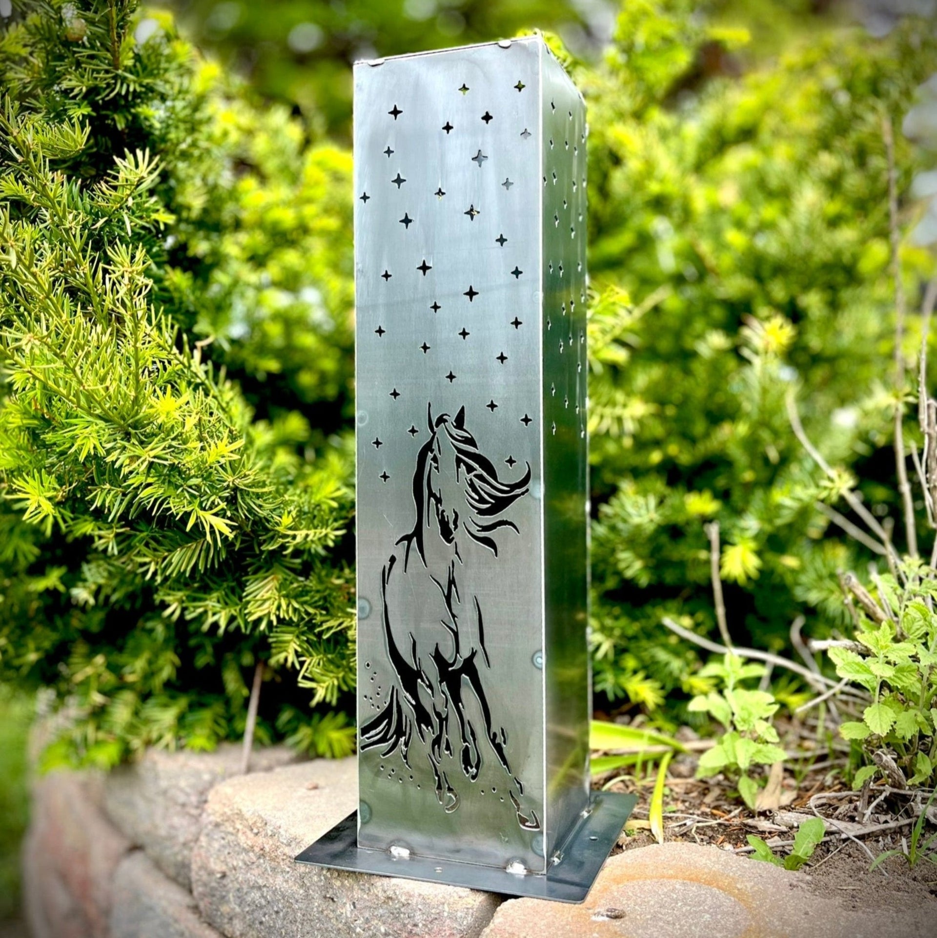 Decorative Garden Pillar with horse design on a garden background