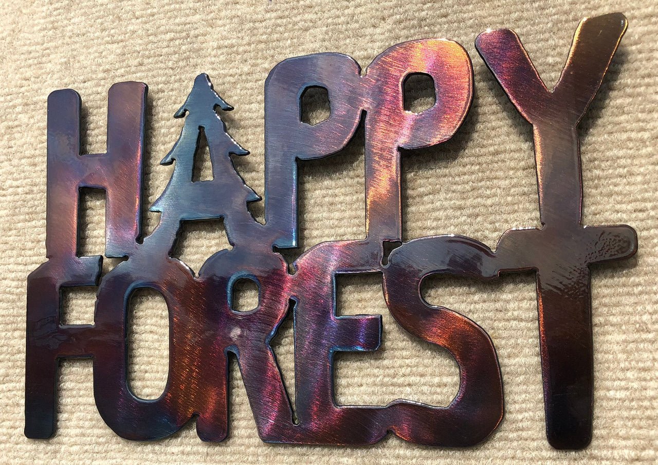 Metallic 'Happy Forest' sign with a tree symbol on a textured beige background