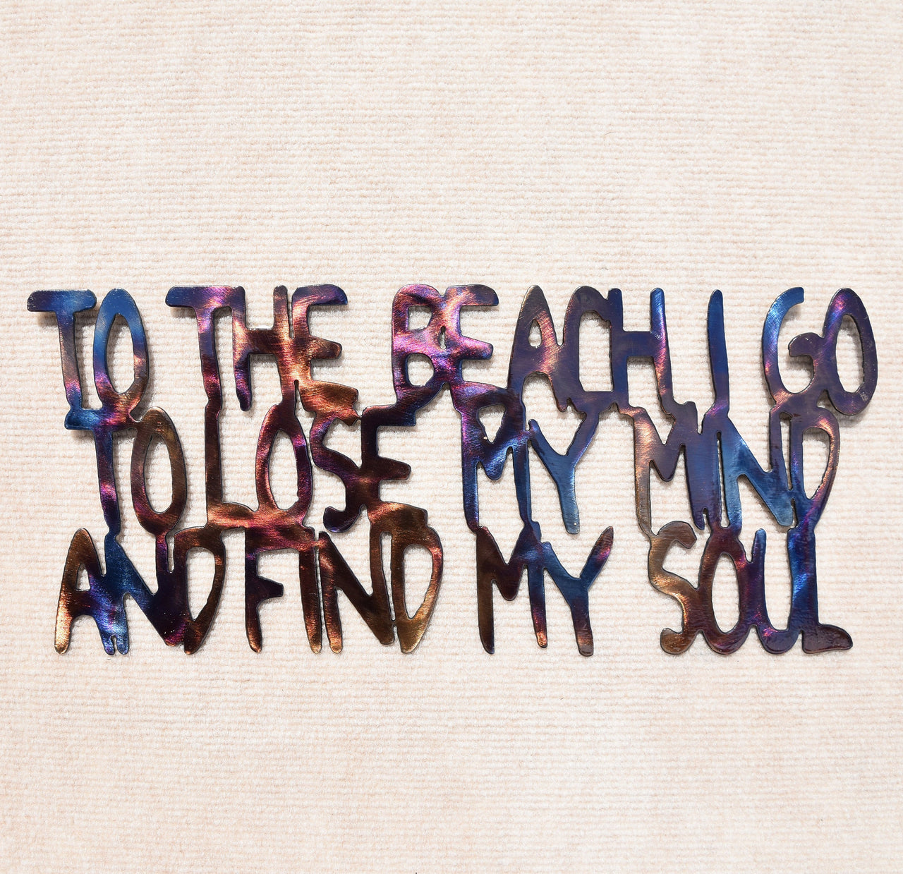 Colorful text on a textured beige background