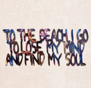 Colorful text on a textured beige background