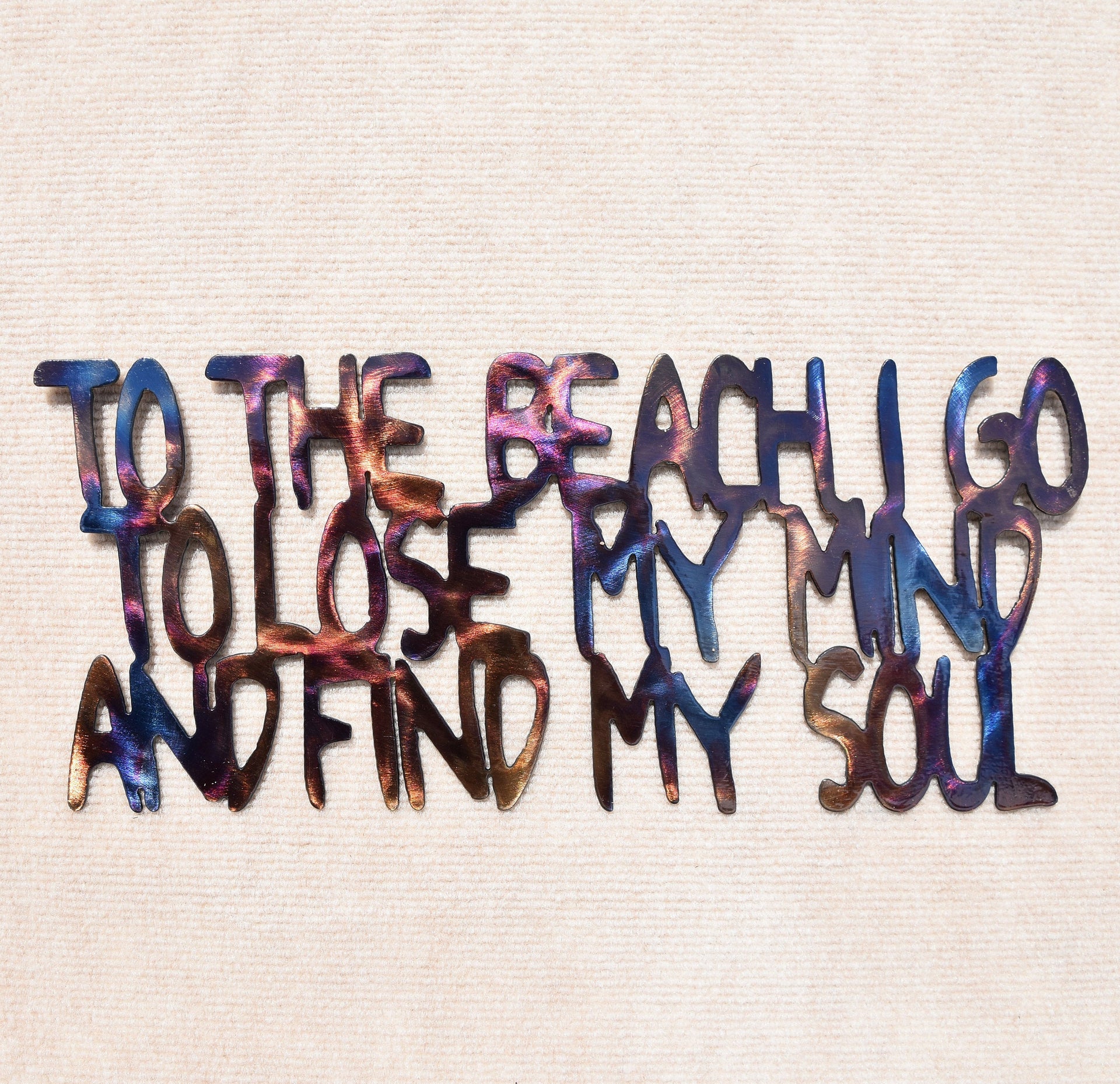 Colorful text on a textured beige background